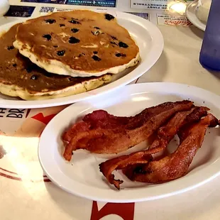 Blueberry pancakes and bacon.