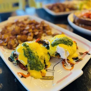 two eggs benedicts on a plate