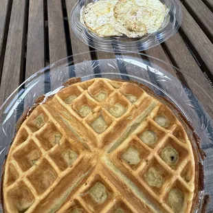 a waffle and a side dish