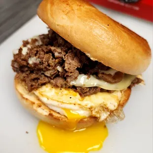 The Steaggle: Steak, Egg (overeasy), Provolone on any Bagel.