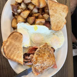 Andrea&apos;s special with home fries and grilled pork loin!