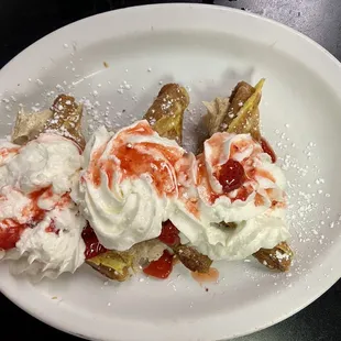 I had the French-toast with whipped cream cheese filling and with covered in strawberries and cool whip.  Yummy !