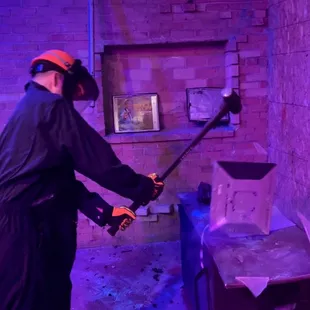 Smashing a monitor with a sledge hammer