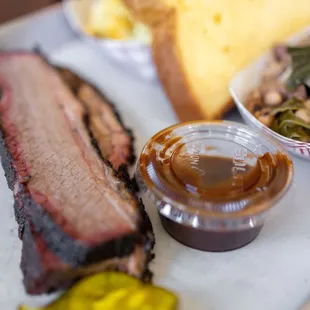 1/3lb Brisket Tray ($21) comes w/ two sides and a slice of bread