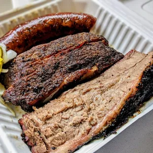 Link, pork ribs, and slabs of brisket (and some pickles!)