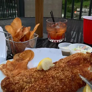 a plate of fish and chips on a table