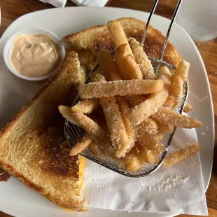 Jalapeño cream cheese bacon grilled cheese with Parmesan fries