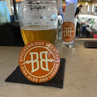 a pint of beer and a coaster