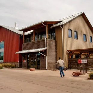 a man walking in front of the building