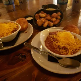 two bowls of chili and bread
