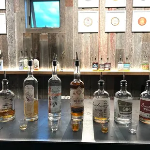 a row of bottles on a bar