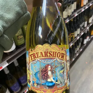 a person holding a bottle of wine