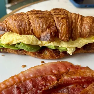 Breakfast croissant, side of bacon.
