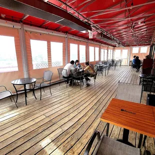 The enclosed balcony on the second floor.