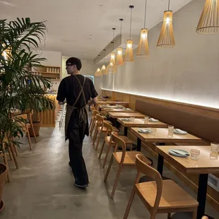 a man walking through a restaurant