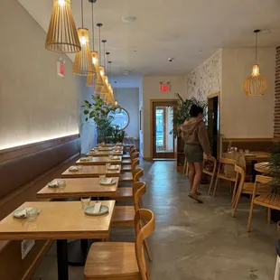 a dining area with tables and chairs