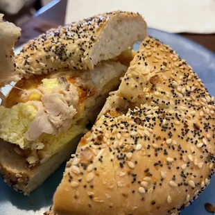 a half eaten bagel sandwich
