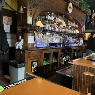 a bar with a lot of bottles of alcohol