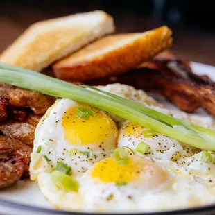 The Brekki Classic: 3 eggs, your choice of sausage, bacon, or ham, smashed potatoes, and toast or tortilla. The perfect hearty breakfast!