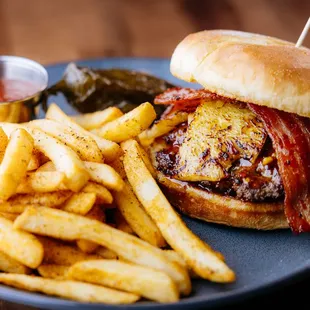 Savor the bold flavors of our Red Chile Hawaiian Burger! Juicy beef, tangy red chile teriyaki, sweet pineapple slices, and crispy bacon!