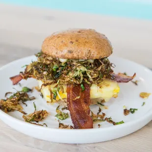 All the Feels egg sandwich with crispy brussel sprouts and bacon