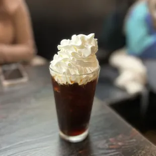 a cold drink with whipped cream