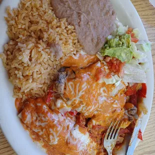 Delicious chipotle grilled chicken and enchilada plate. Usually cooked with fries but substituted for refried beans.