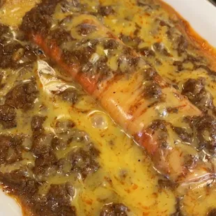 Cheese enchilada with a meat gravy