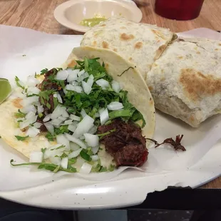 Barbacoa taco and chicken breast burrito