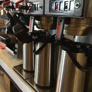 a row of coffee machines