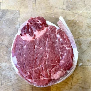 a piece of beef on a cutting board