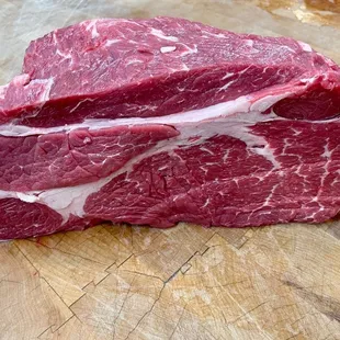 a piece of beef on a cutting board