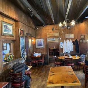 a restaurant with wood paneled walls