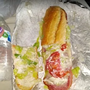 a sub sandwich and a water bottle