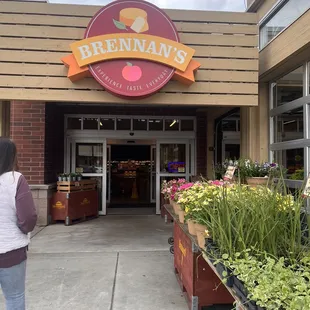 a woman standing in front of a store