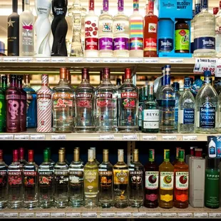 a shelf of liquor bottles
