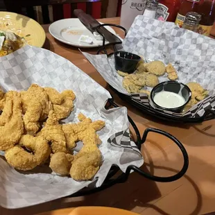 Catfish bites appetizer and the nearly eaten pickle/jalapeños.  Certain appetizers half price till 6:00 pm