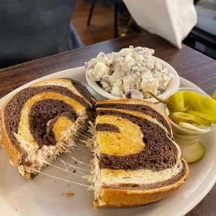 a plate with a sandwich and a side of coleslaw