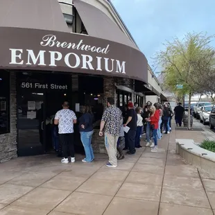 a line of people waiting outside