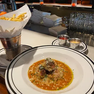 Chicken meatballs and kennebec French fries. Yummy house made aioli too