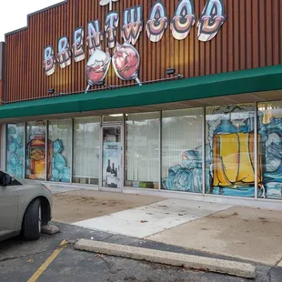 Enter driveway from far right and exit from left of this building