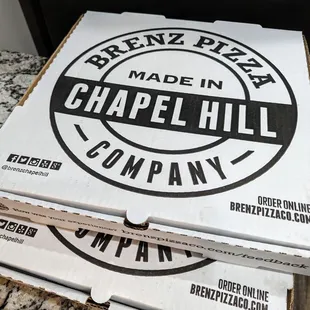 Brenz Pizza Company Made in Chapel Hill pizza boxes as of Thursday, May 2, 2024. $3.50 delivery fee.