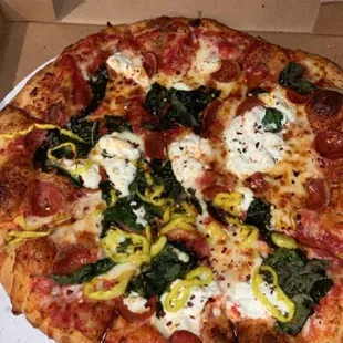14&quot; pizza cut pie style with pepperoni, fresh spinach, banana peppers, and ricotta cheese
