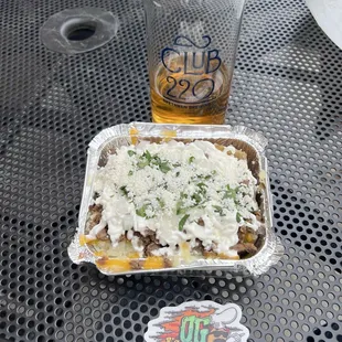 Carne Asada half order potato with a lawnmower beer, amazing combination
