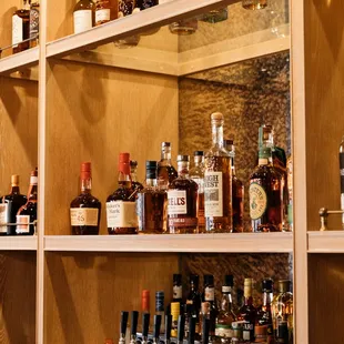 a shelf of liquor bottles