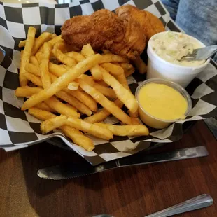 Chicken tenders, fries and coleslaw
