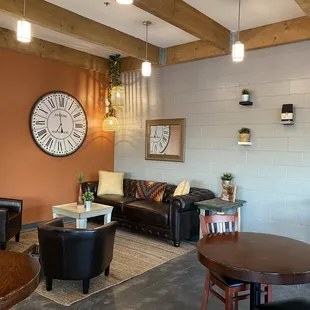 a living room with a clock on the wall