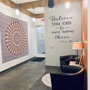 a wall with a quote on it