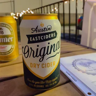 two cans of beer on a table