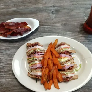 Club sandwich with sweet potato fries